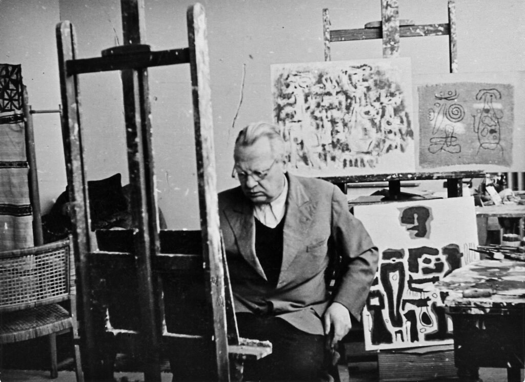 Willi Baumeister an einer Staffelei in seinem Atelier